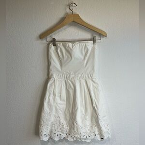Hollister white strapless mini dress with eyelet detailing at the hem M cotton